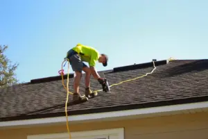 a commercial roofer repairing a roof