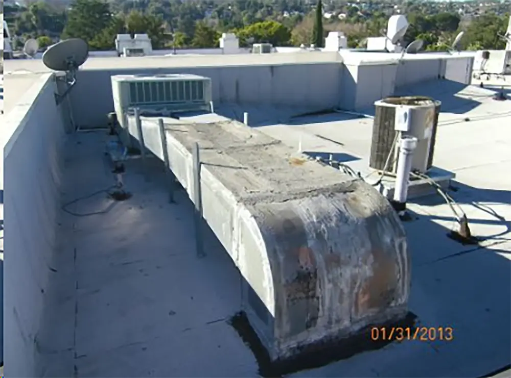 an old, poorly maintained AC unit and ductwork