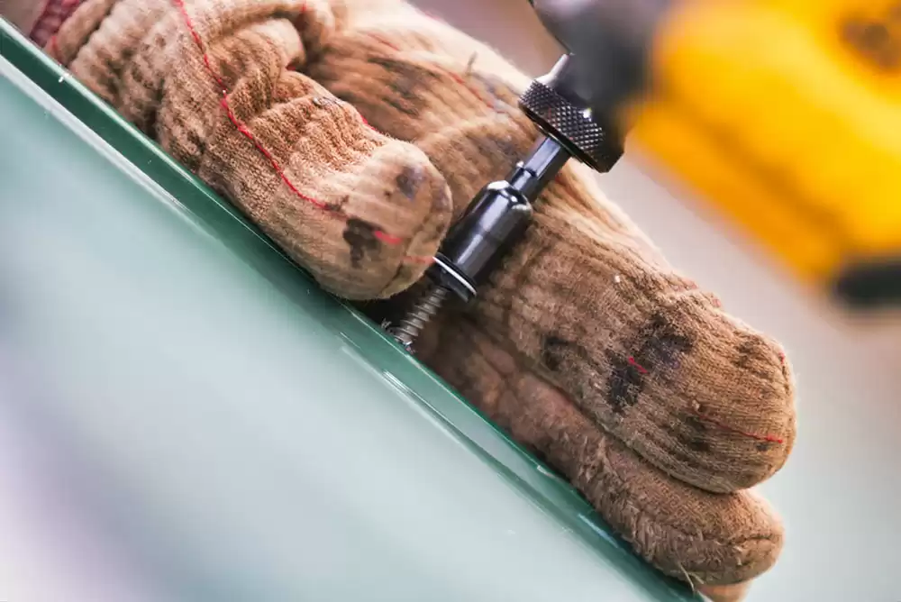 a commercial roofer performing maintenance on a commercial roof